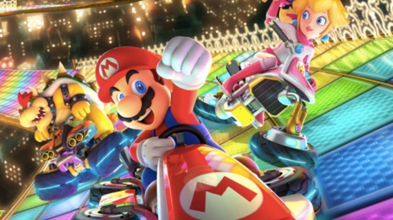 Mario, Peach, and Bowser riding karts
