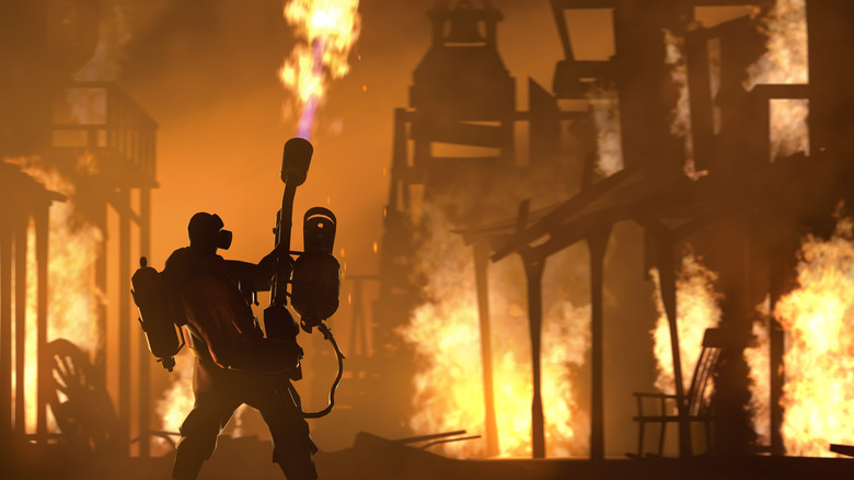 Person using flamethrower and inflamed buildings