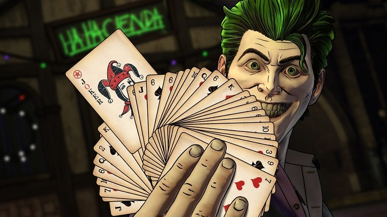 John Doe holding cards