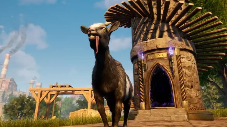 Goat standing in front of tower, tongue out