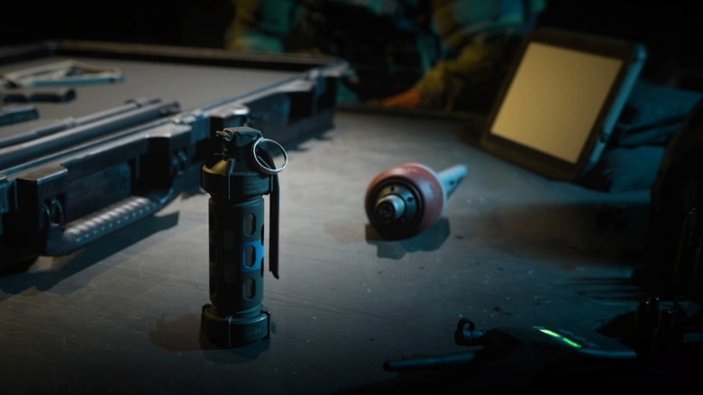 Stun grenade and other equipment on table