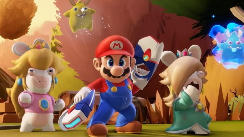 Mario standing with some Rabbids