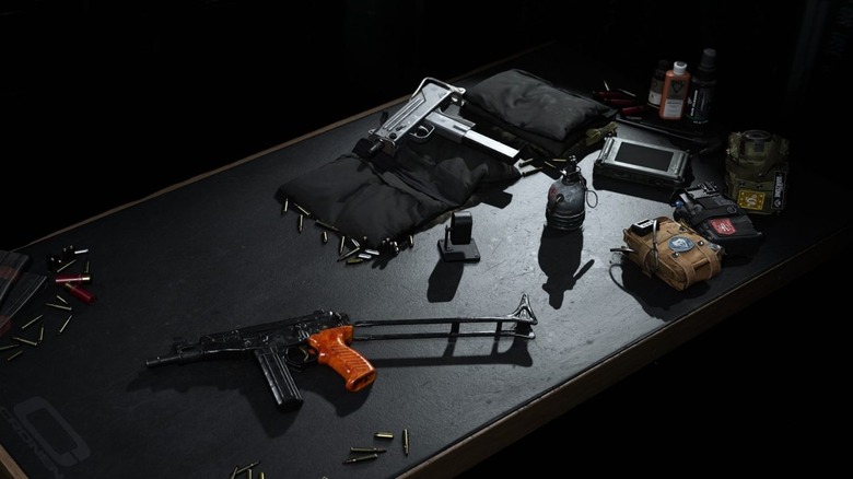 Weapons and equipment on table