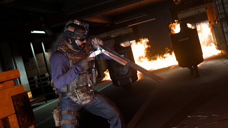 Player reloading shotgun in burning building