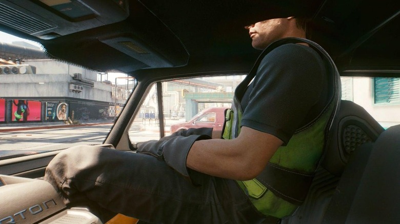 Character sits halfway through car roof