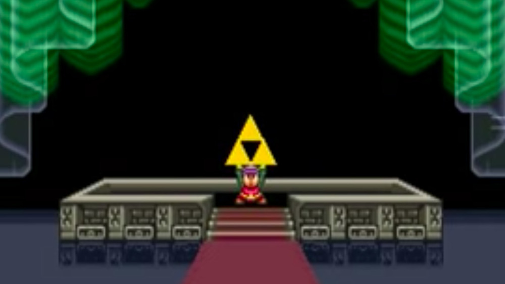 Link holds the Triforce