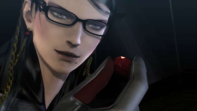 Bayonetta holding a gemstone