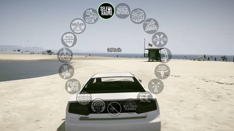 A car on the beach with radio stations displayed