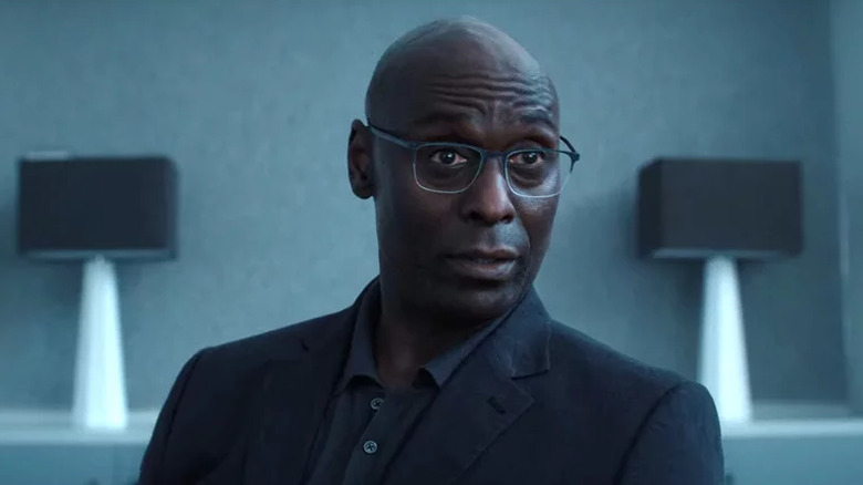 Lance Reddick wearing glasses