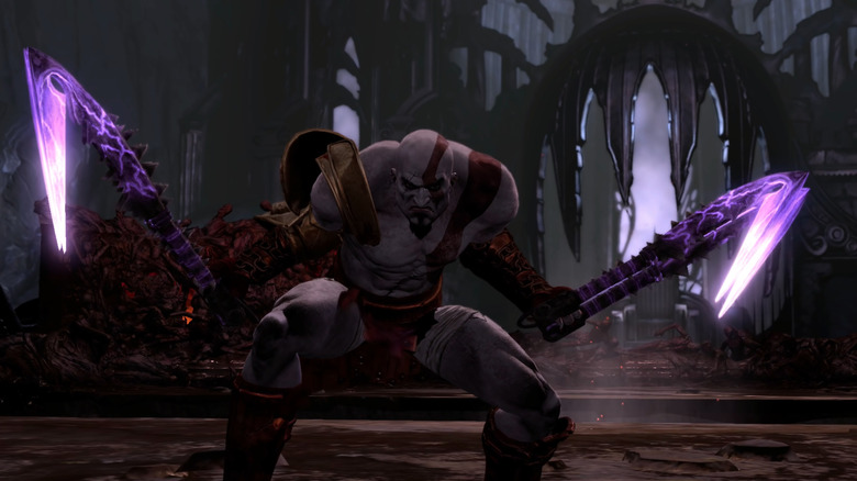 Kratos holding the Claws of Hades