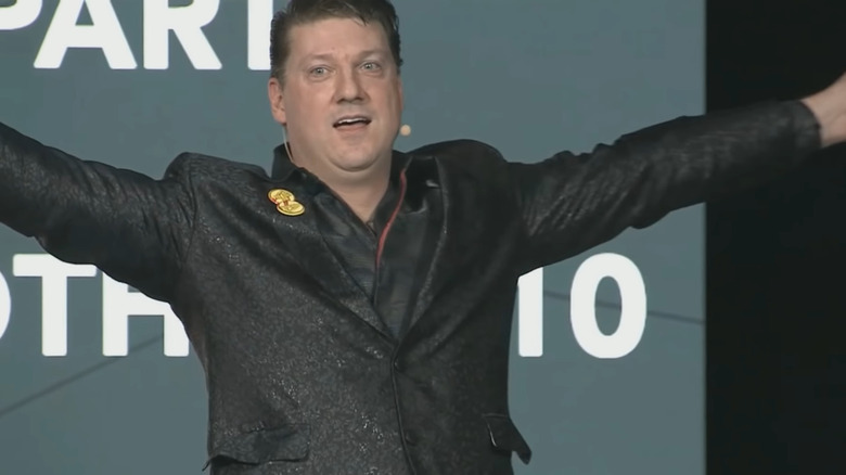 Randy Pitchford thinking he's king of the world after doing an amateur card trick