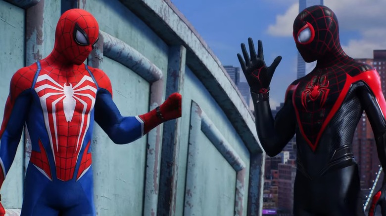 Spider-Men fist bumping