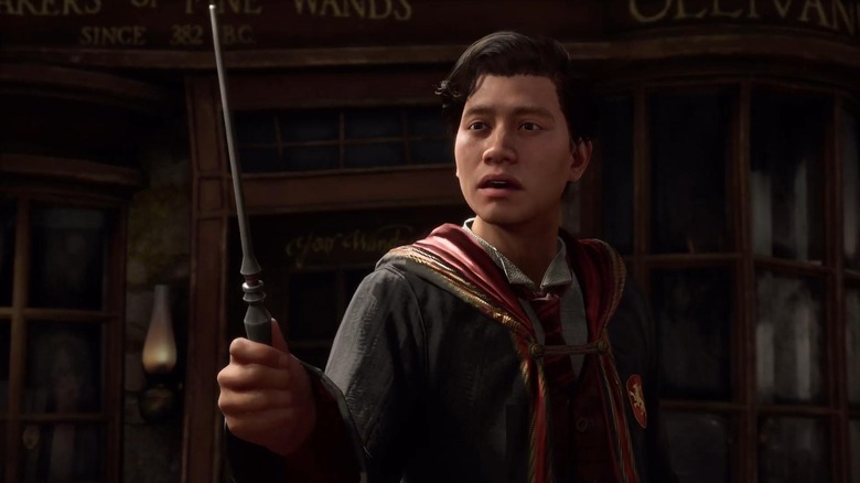 Hogwarts Legacy player holding wand