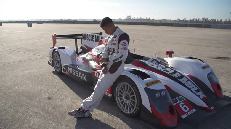 Mardenborough leaning against his car