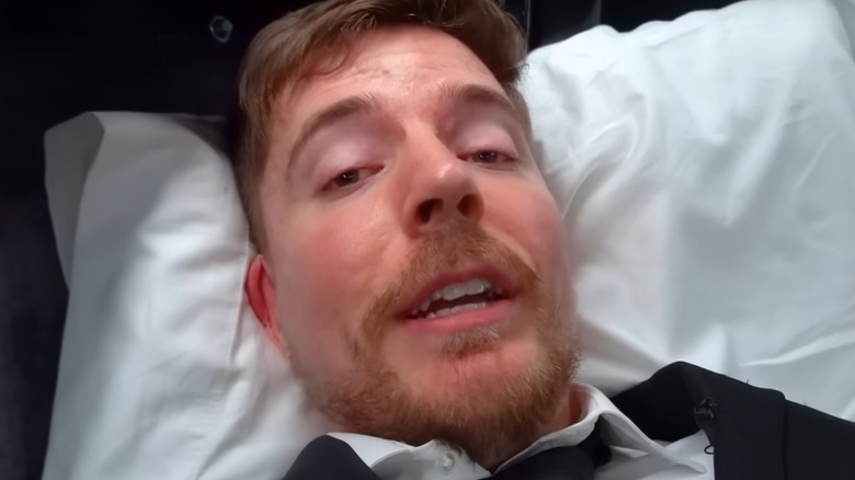 MrBeast wearing suit in coffin