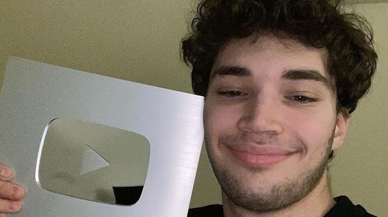 Adin Ross with YouTube plaque
