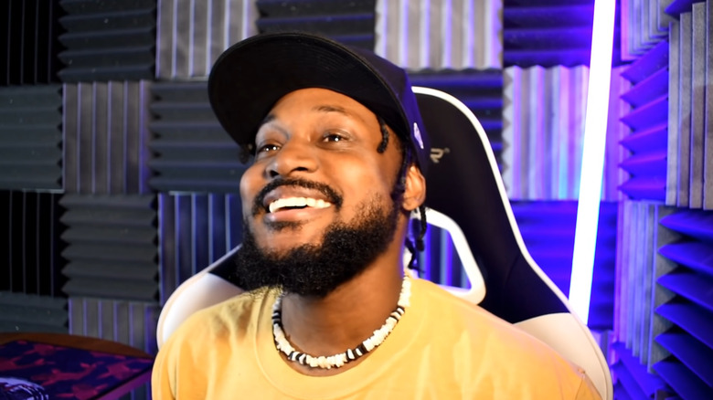 CoryxKenshin smiling with a hat on