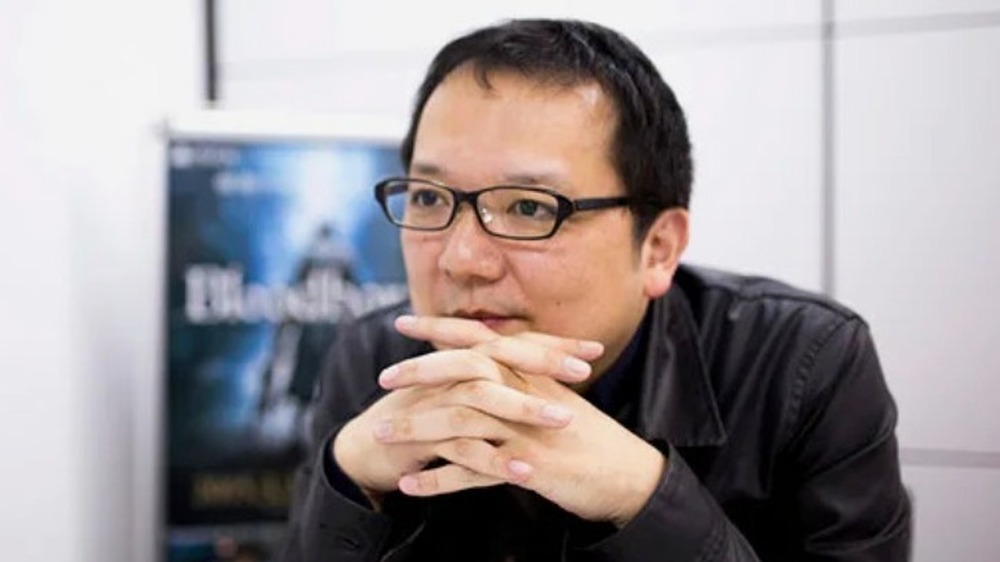 Hidetaka Miyazaki lacing fingers together