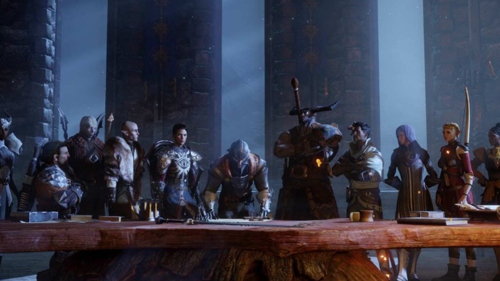 A group of companions in Dragon Age: Inquisition stand around the Inquisitor