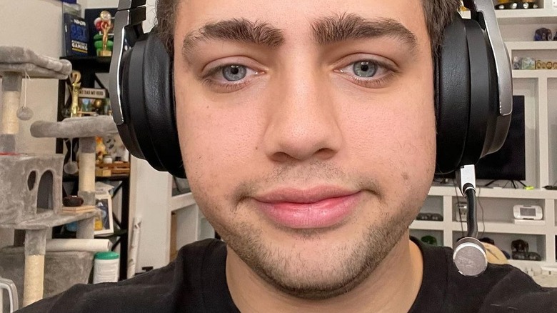 Mizkif wearing over the ear headphones