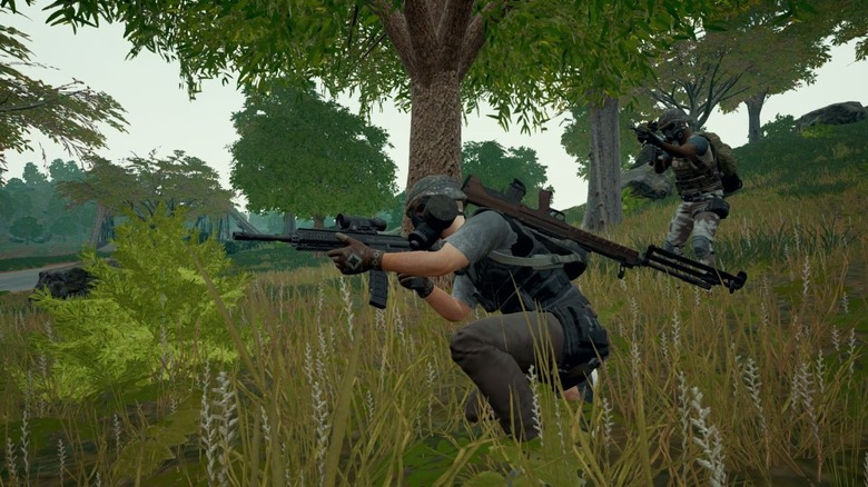 Two PUBG characters aiming with rifles