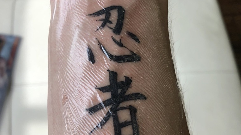 Ninja showing off his new tattoo