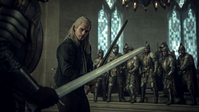 Geralt fighting against a knight in The Witcher Netflix series