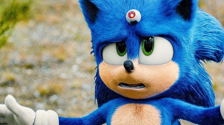 Sonic looks quizzically at a small device on his forehead