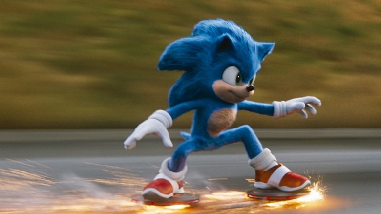 Sonic skids across the road on a pair of metal discs, sparks shooting out from his feed