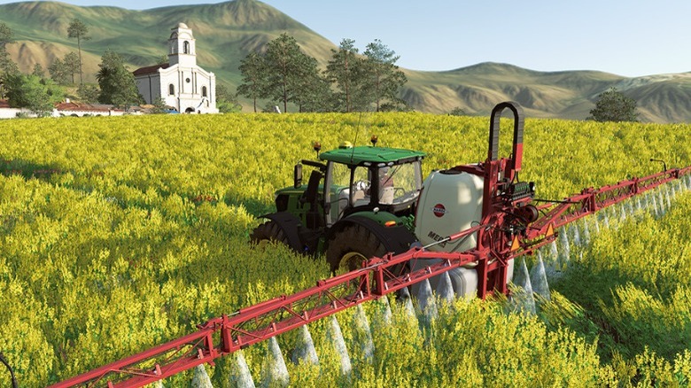 Tractor drives across farming field
