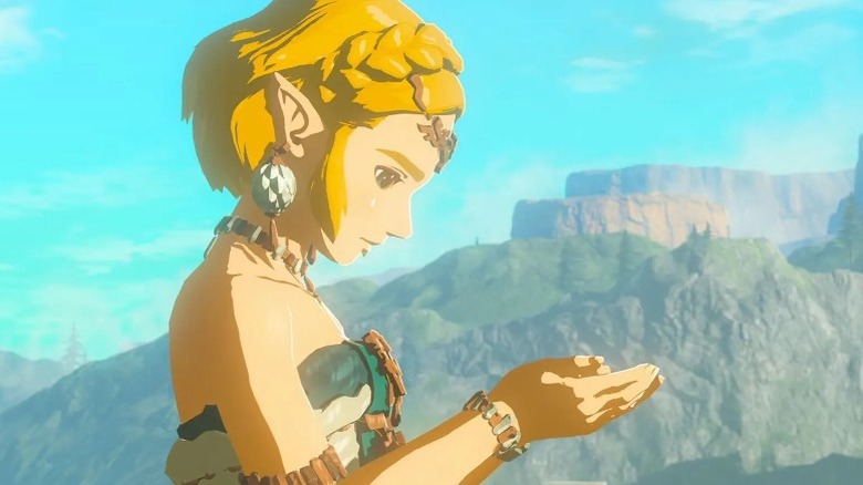 Zelda looking at her cupped hands