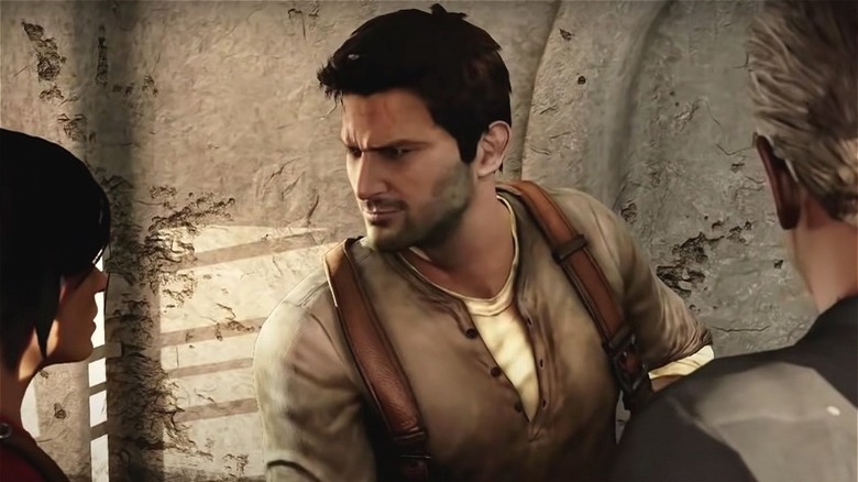 Nathan Drake talks with crew