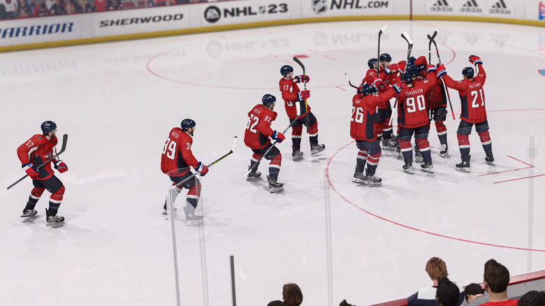 Team celebrating on ice