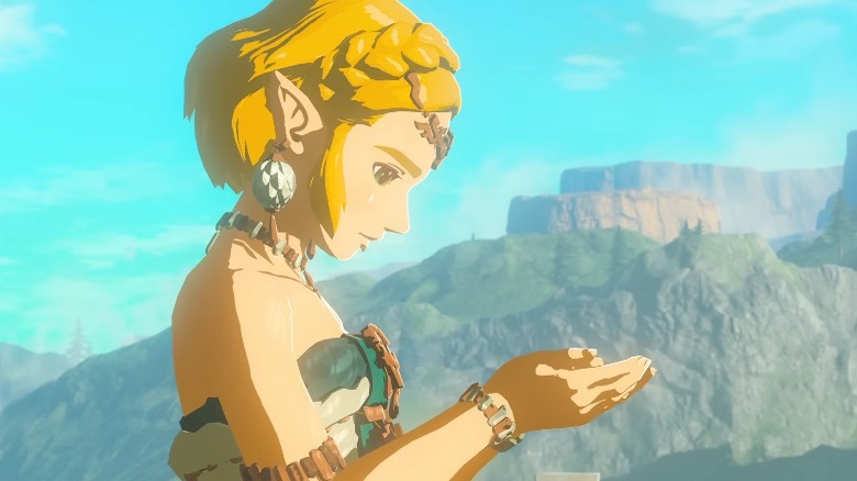 Zelda looking at cupped hands