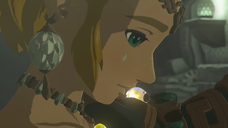 Zelda with hand on her shoulder