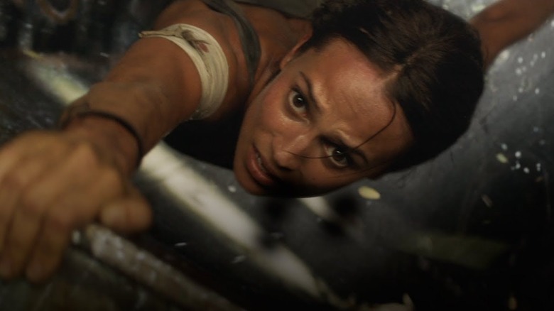 Lara Croft holding onto ledge