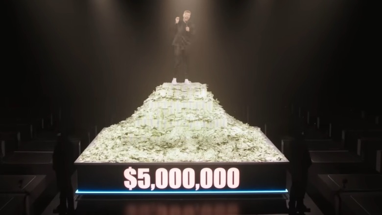 MrBeast standing on five million dollars