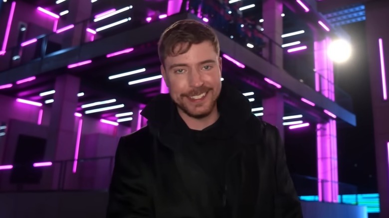 MrBeast standing in front of glowing towers