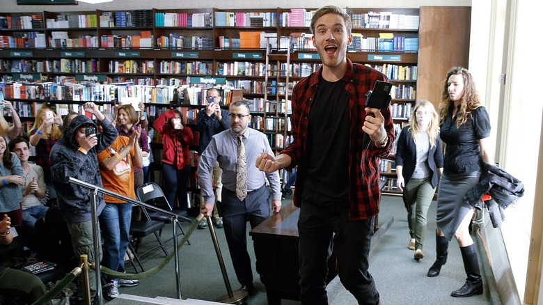 PewDiePie surrounded by fans at book signing