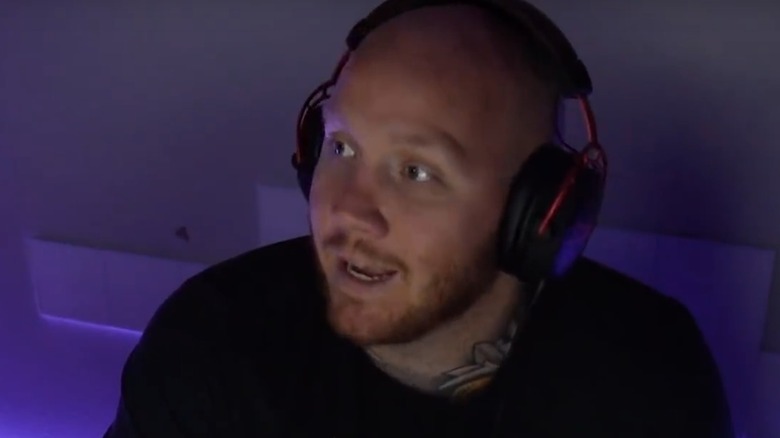 TimTheTatMan wearing headphones