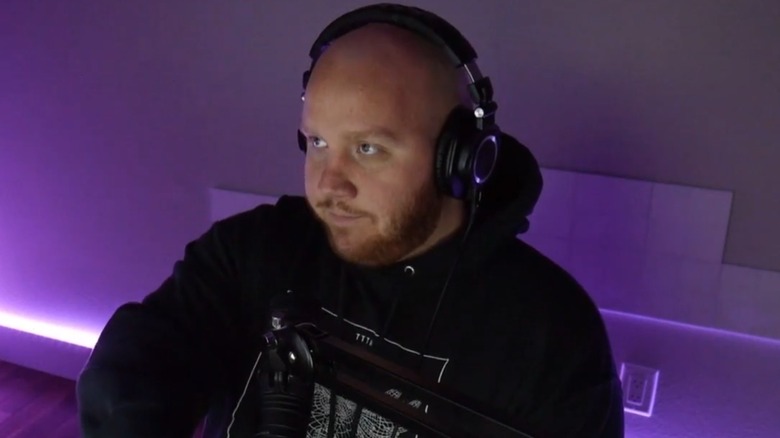 TimTheTatMan sitting in front of mic for stream