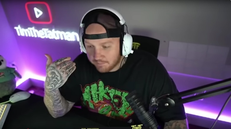 TimTheTatMan talking into microphone