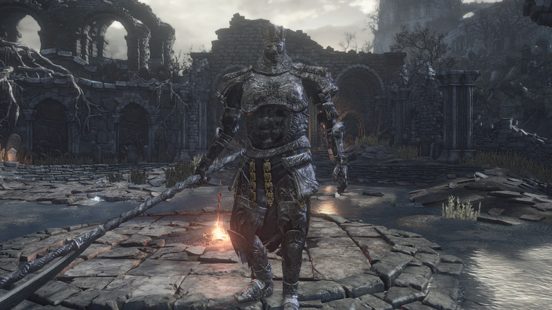 Iudex Gundyr standing in front of bonfire