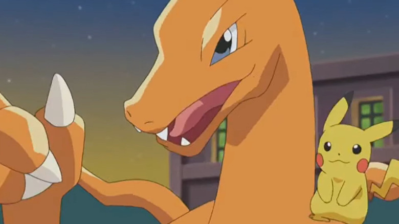 Charizard carrying Pikachu