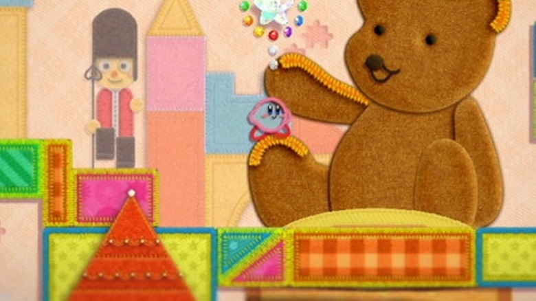 Kirby climbing on teddy bear