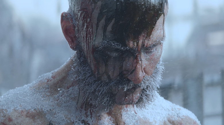 frozen and bloodied man