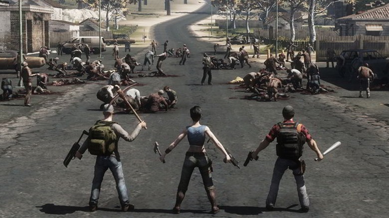 Three survivors facing zombie horde