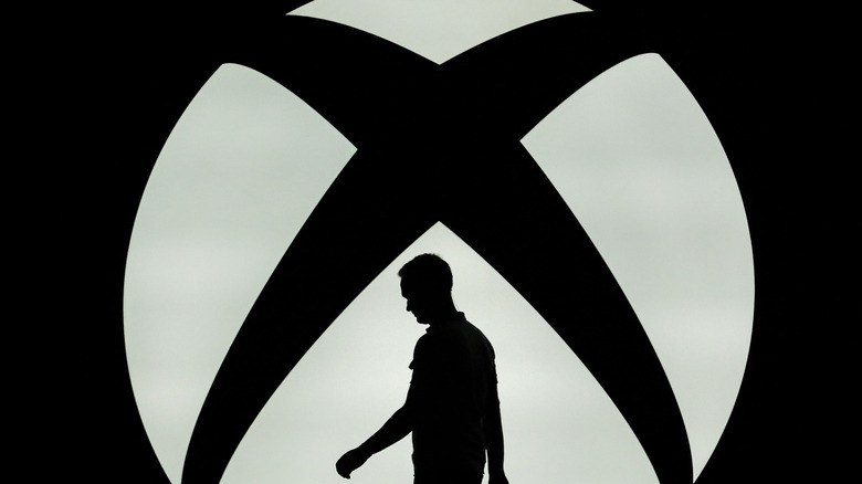 Man in shadow with Xbox logo
