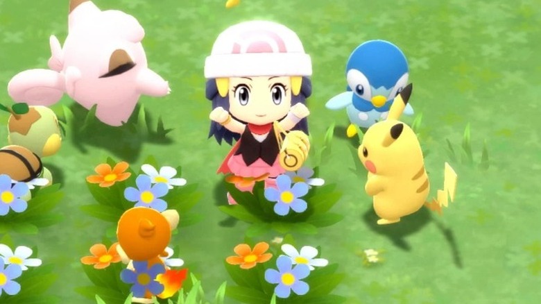 Trainer in flowers with pokemon
