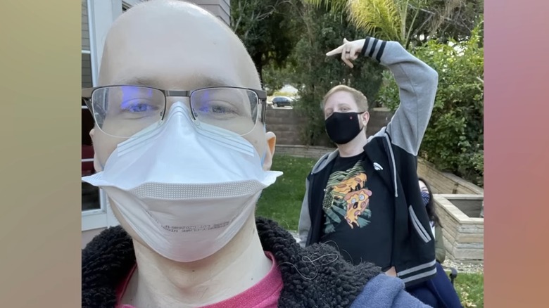 Technoblade and another person wearing masks in selfie